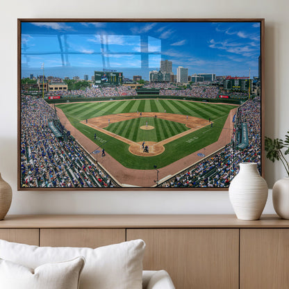 A wide-angle shot of a baseball field filled with spectators, with players on the field and the iconic Wrigley Field scoreboard in the background.