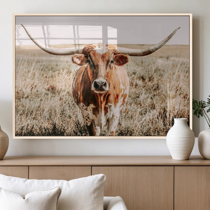Framed longhorn cow canvas wall art with rustic prairie background, western animal print perfect for farmhouse or ranch style decor