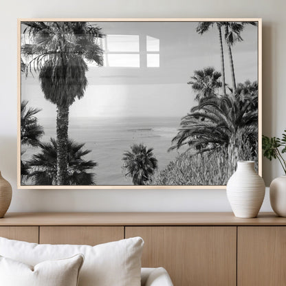 Monochrome canvas of palm trees framing a coastal surf scene, perfect for California-inspired or retro black-and-white beach decor.