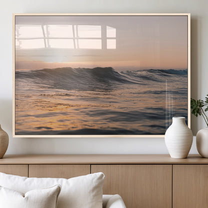 Framed canvas of ocean waves glowing in sunset light, ideal for golden hour calm or peaceful coastal-inspired wall decor.