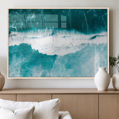 Aerial view of turquoise ocean waves crashing with white foam, perfect for tropical coastal or modern beach-style home decor.