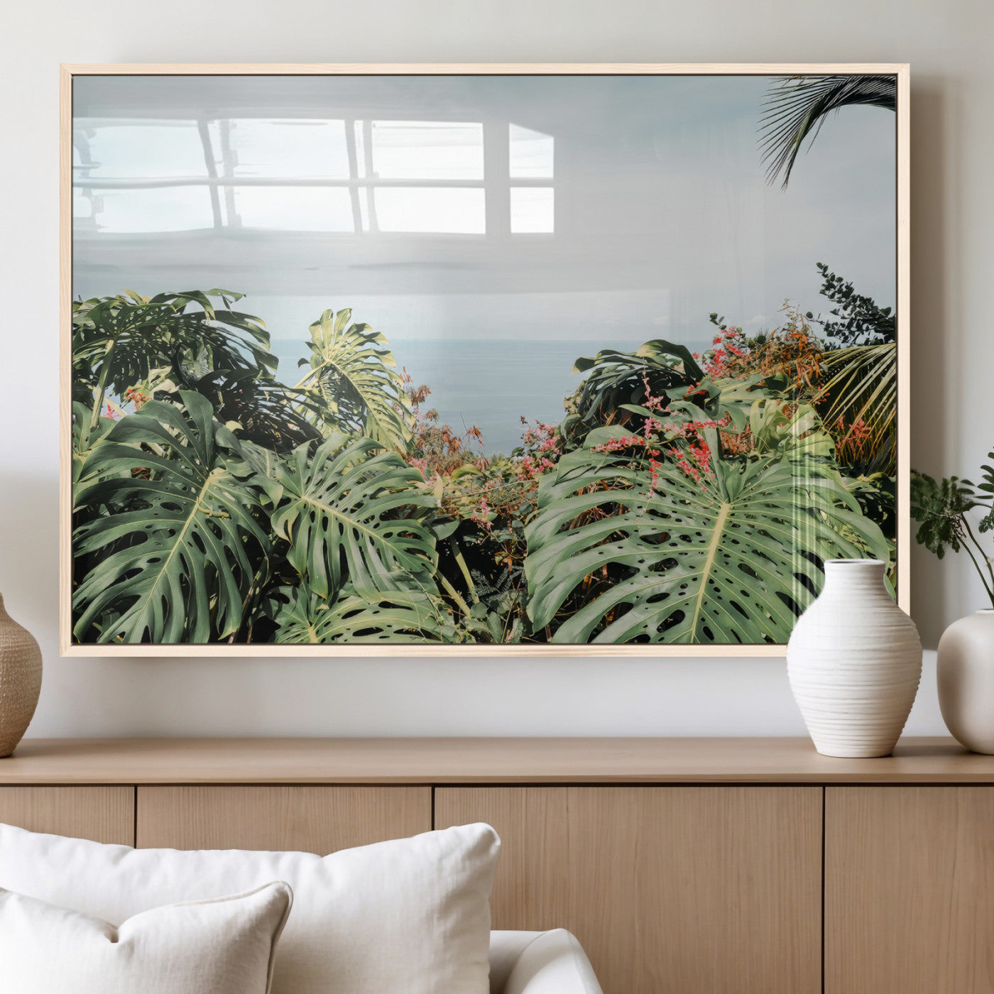Monstera leaves and tropical flowers framing a calm ocean view, ideal for tropical coastal or exotic jungle-style interior wall decor.