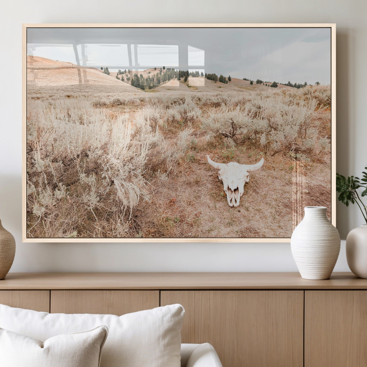 Rustic bull skull on dry sagebrush field under soft light, ideal for western minimal or desert prairie-style wall decoration.