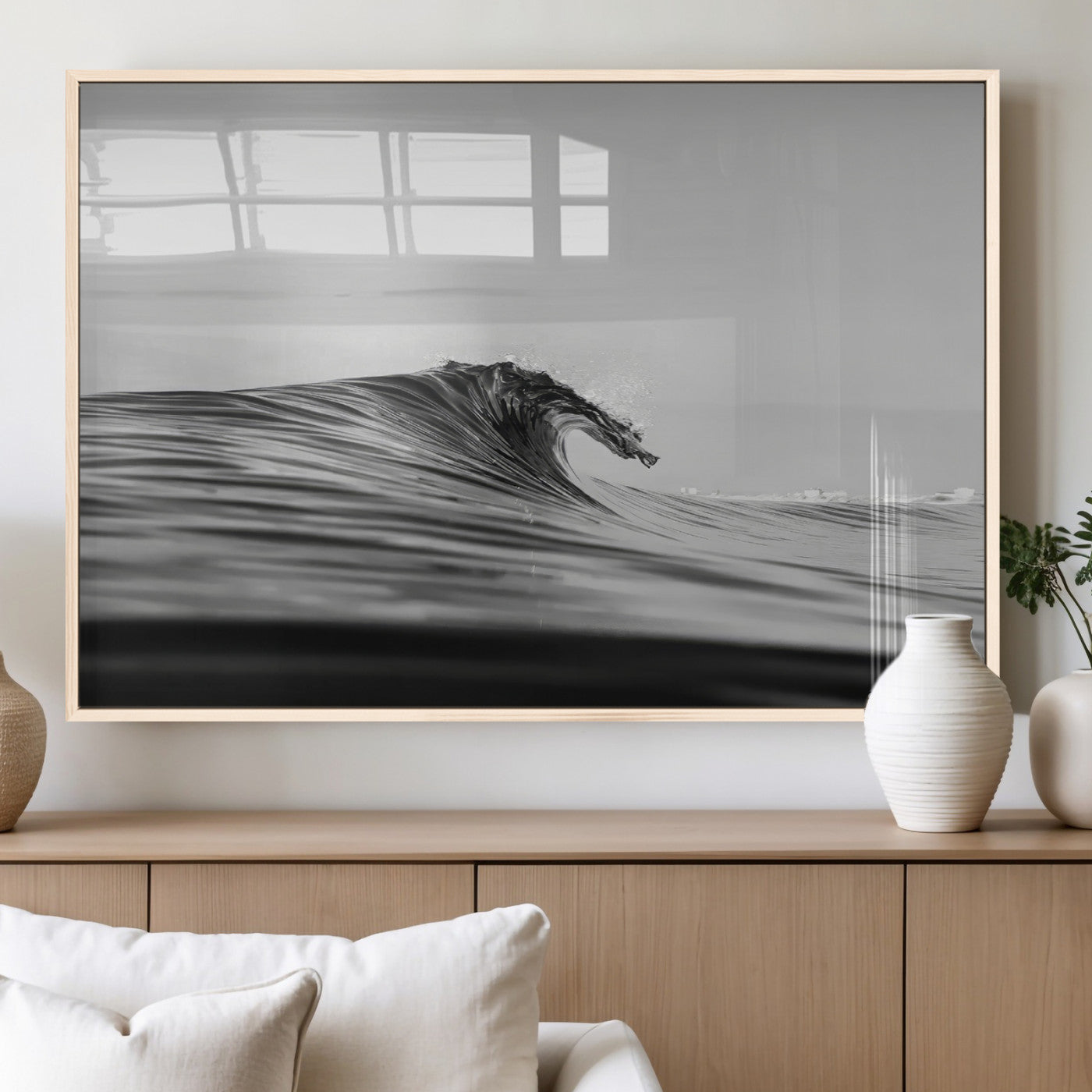 Striking black and white photo of a curling wave, ideal for modern coastal or minimalist wall decor settings.