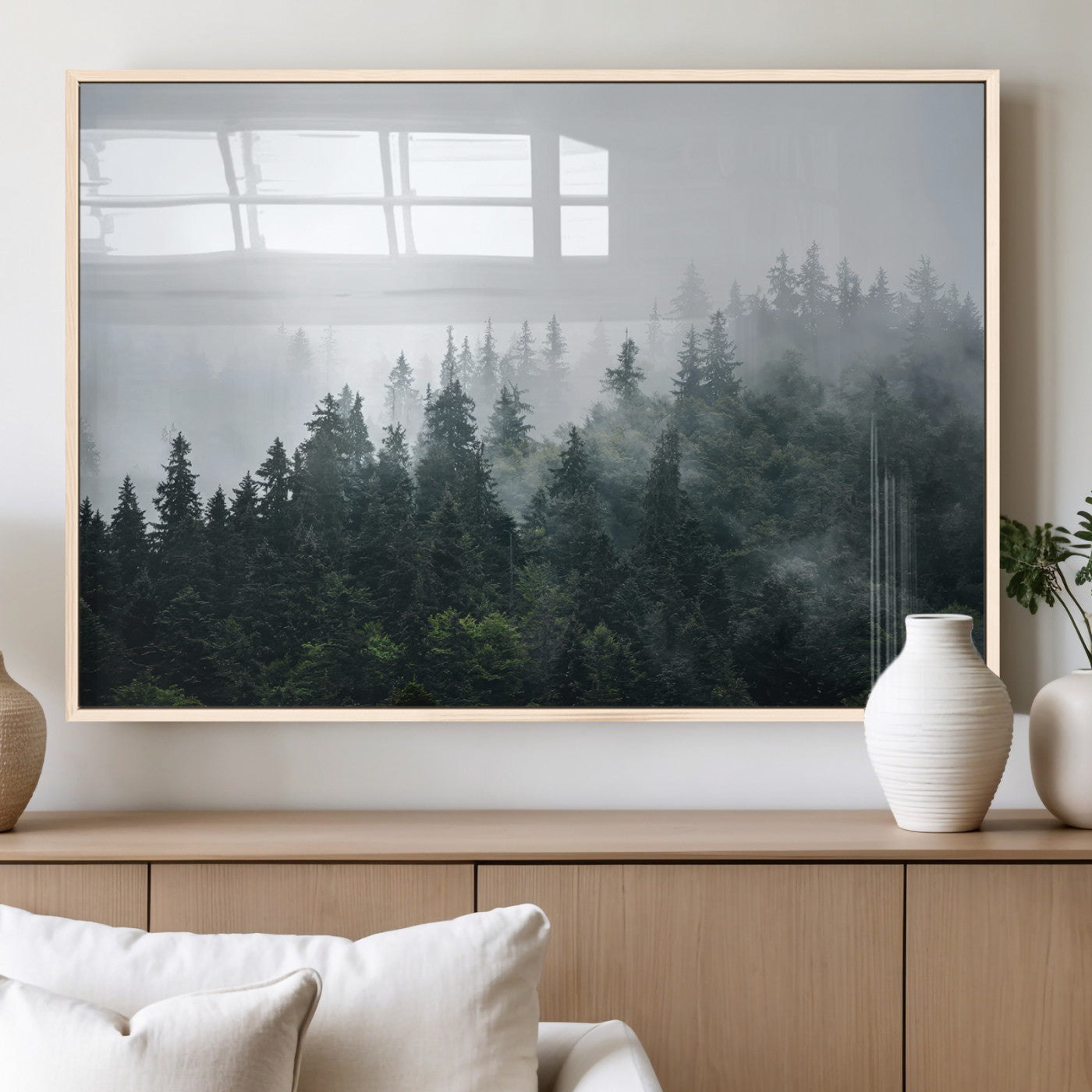 A misty evergreen forest shrouded in soft fog, creating a tranquil and moody landscape with lush green trees fading into the distance.