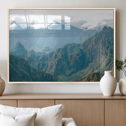 A misty mountain landscape with cloud-covered Andean peaks and lush green valleys, creating a dramatic and serene view, perfect for rustic or nature-inspired home decor.