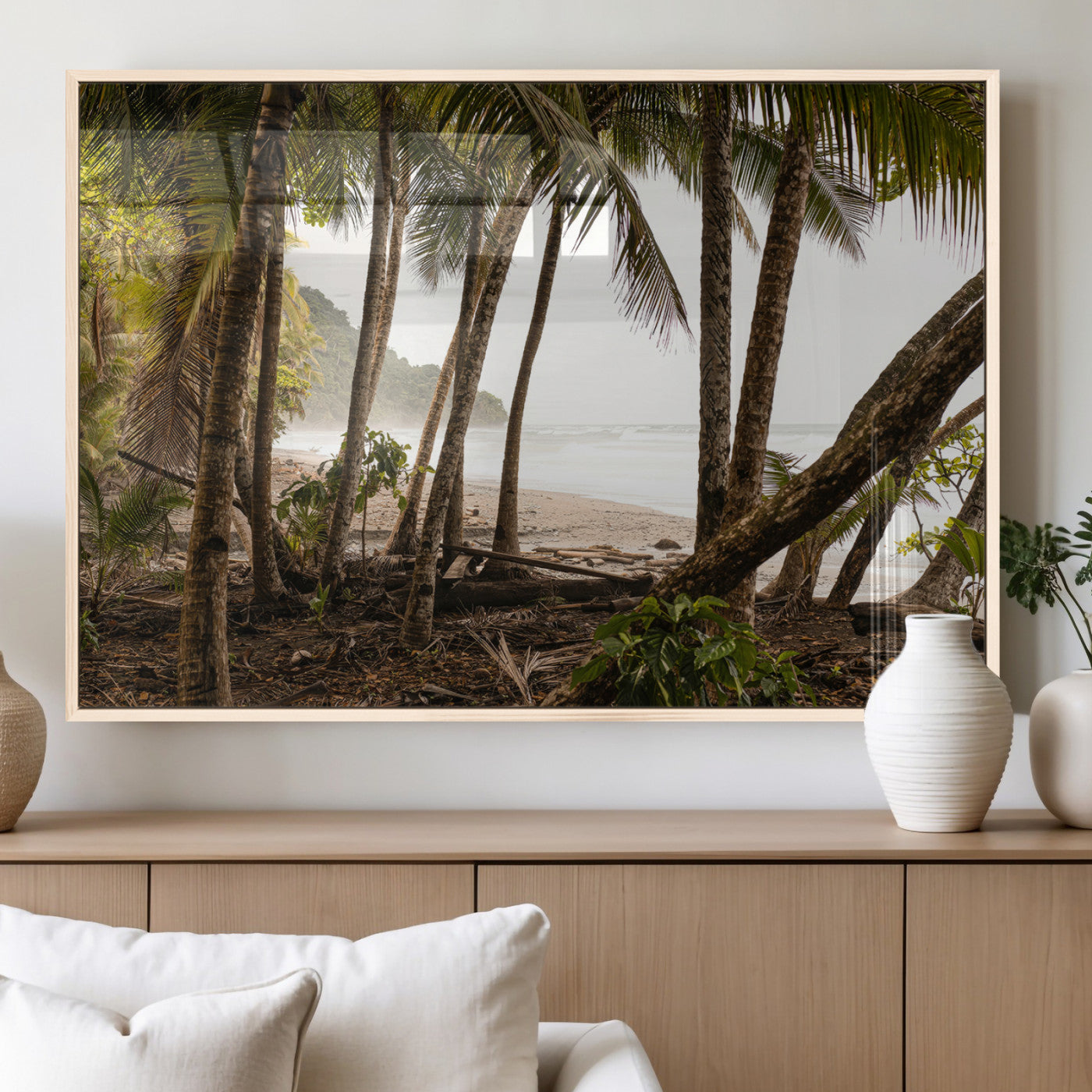 Dense tropical palm trees framing a sandy beach and ocean shore, ideal for jungle or coastal themed interior wall decor.