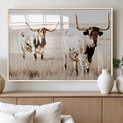 Two Texas longhorn cows standing in a sepia-toned pasture, evoking rustic charm perfect for farmhouse or western country interiors. (