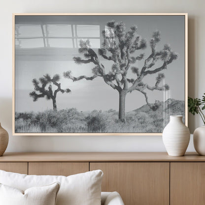 Black and white Joshua tree in a desert landscape with soft light and dry brush, perfect for rustic or minimalist home decor.