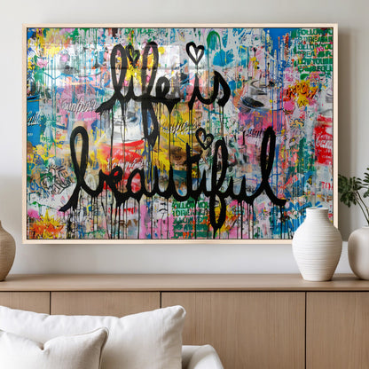 Colorful urban-style canvas with graffiti text “Life is Beautiful” in black paint, ideal for bold or street-themed home decor.