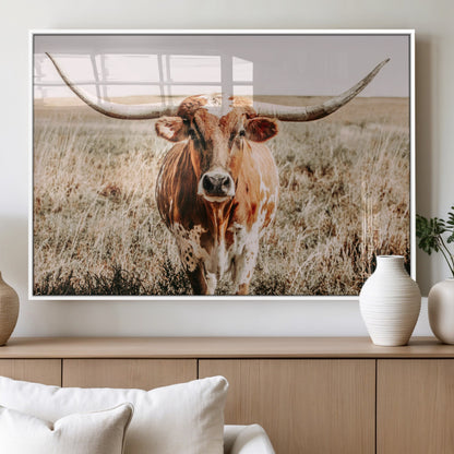 Framed longhorn cow canvas wall art with rustic prairie background, western animal print perfect for farmhouse or ranch style decor