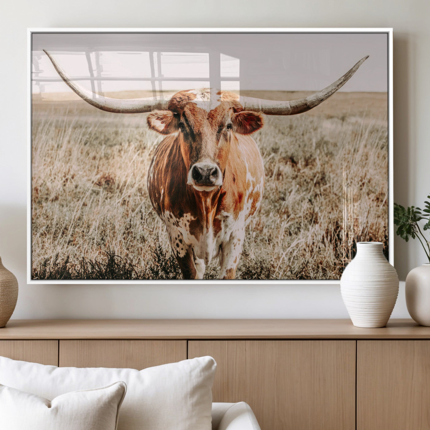 Framed longhorn cow canvas wall art with rustic prairie background, western animal print perfect for farmhouse or ranch style decor