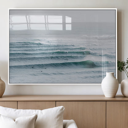 High-angle view of surfers lining up across layered ocean waves, ideal for minimal coastal or surf-inspired room decor.