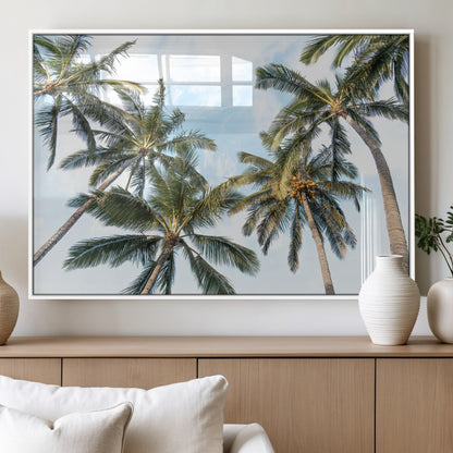 Framed canvas of tall palm trees reaching into a tropical sky, ideal for beach home or relaxed island-inspired wall decor.