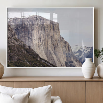 Framed canvas of El Capitan’s vertical granite face in Yosemite with snowy peaks, ideal for Sierra minimalism or mountain-inspired decor.