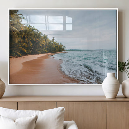 Framed canvas of a tropical beach with palm trees and soft waves, ideal for coastal escape or serene nature-inspired home decor.