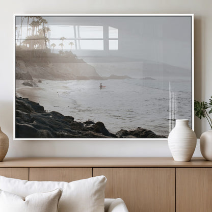 Framed canvas of a surfer in misty coastal tones at a foggy California beach, ideal for minimalist coastal beach or serene ocean-themed decor.