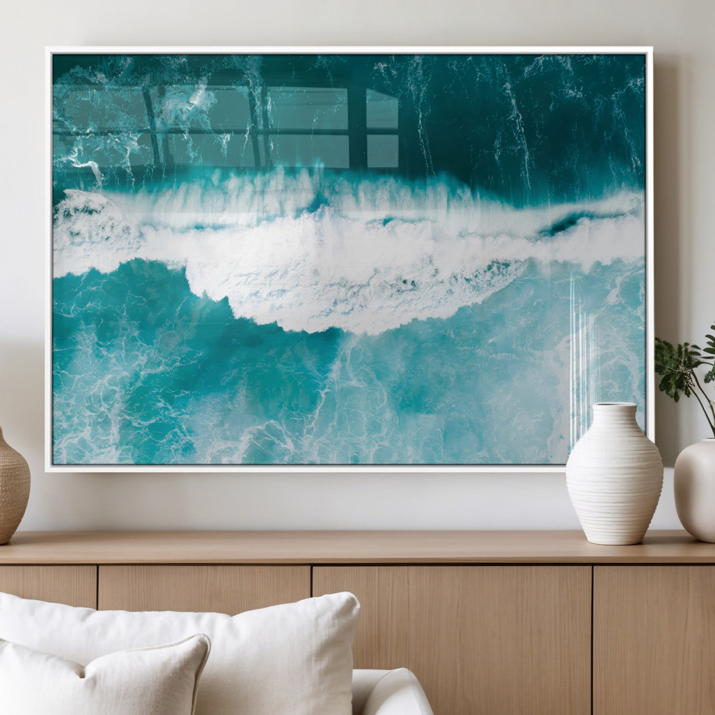 Aerial view of turquoise ocean waves crashing with white foam, perfect for tropical coastal or modern beach-style home decor.