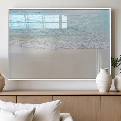 Soft shoreline with gentle aqua waves on smooth sand, ideal for minimalist coastal or pastel ocean-inspired home wall decor.