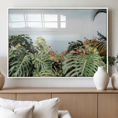 Monstera leaves and tropical flowers framing a calm ocean view, ideal for tropical coastal or exotic jungle-style interior wall decor.