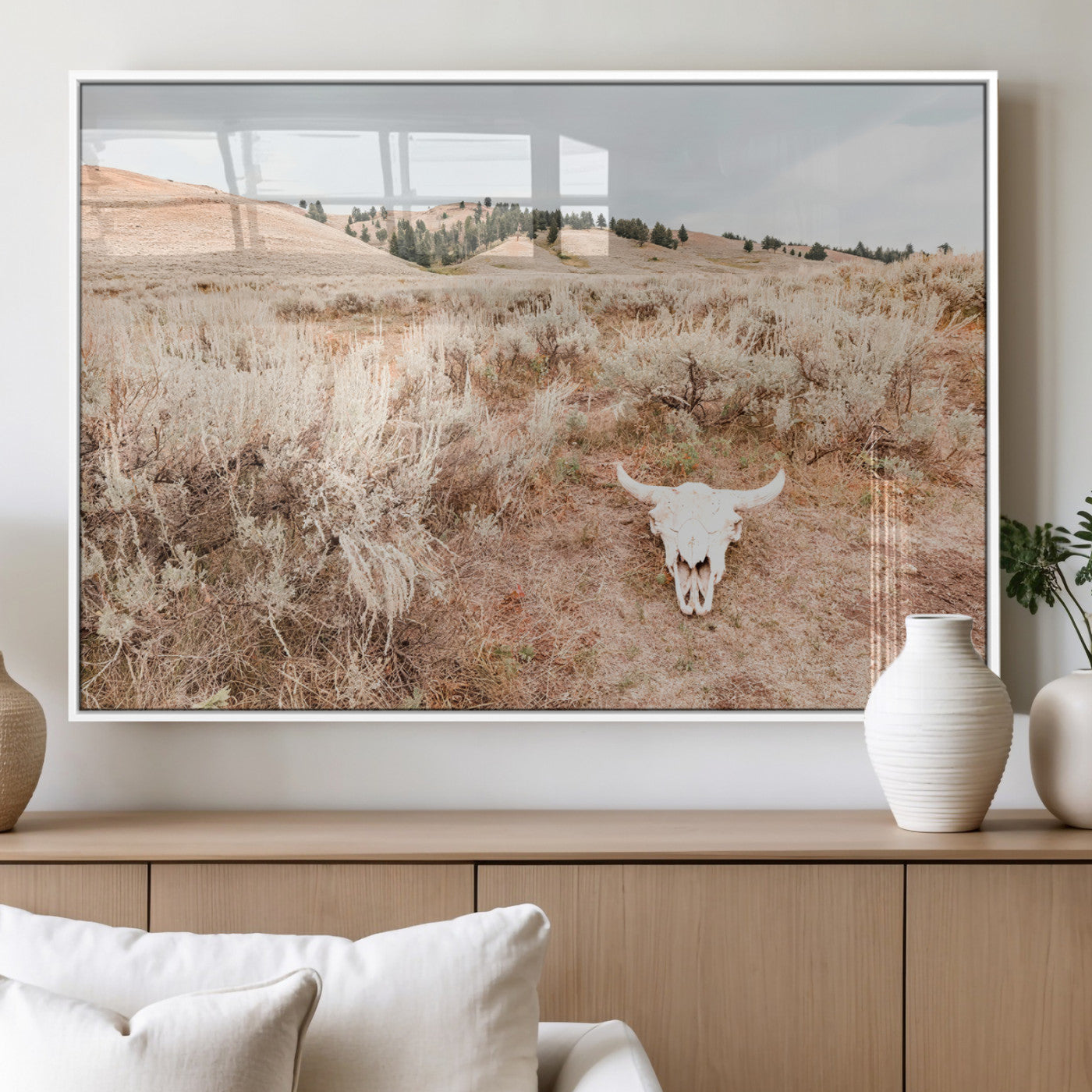 Rustic bull skull on dry sagebrush field under soft light, ideal for western minimal or desert prairie-style wall decoration.