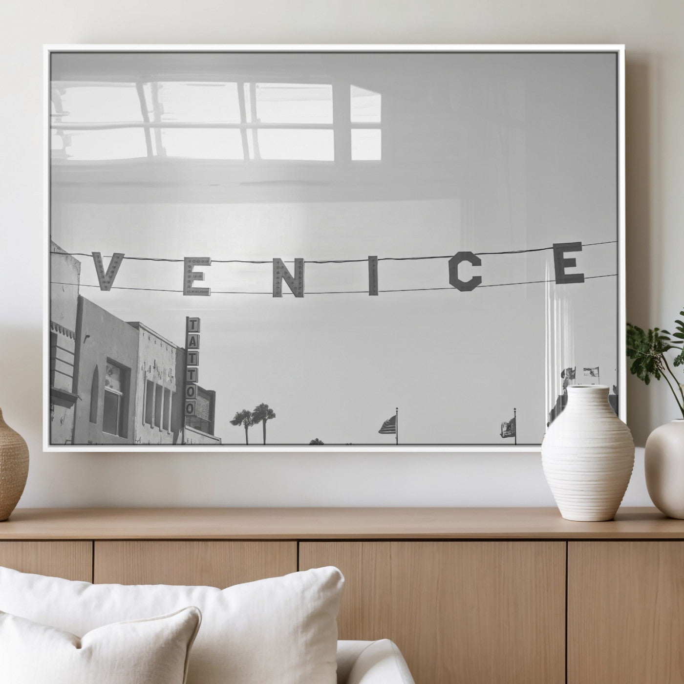 Black and white photo of Venice Beach sign and palm-lined street, perfect for urban coastal or minimalist LA-inspired wall decoration.