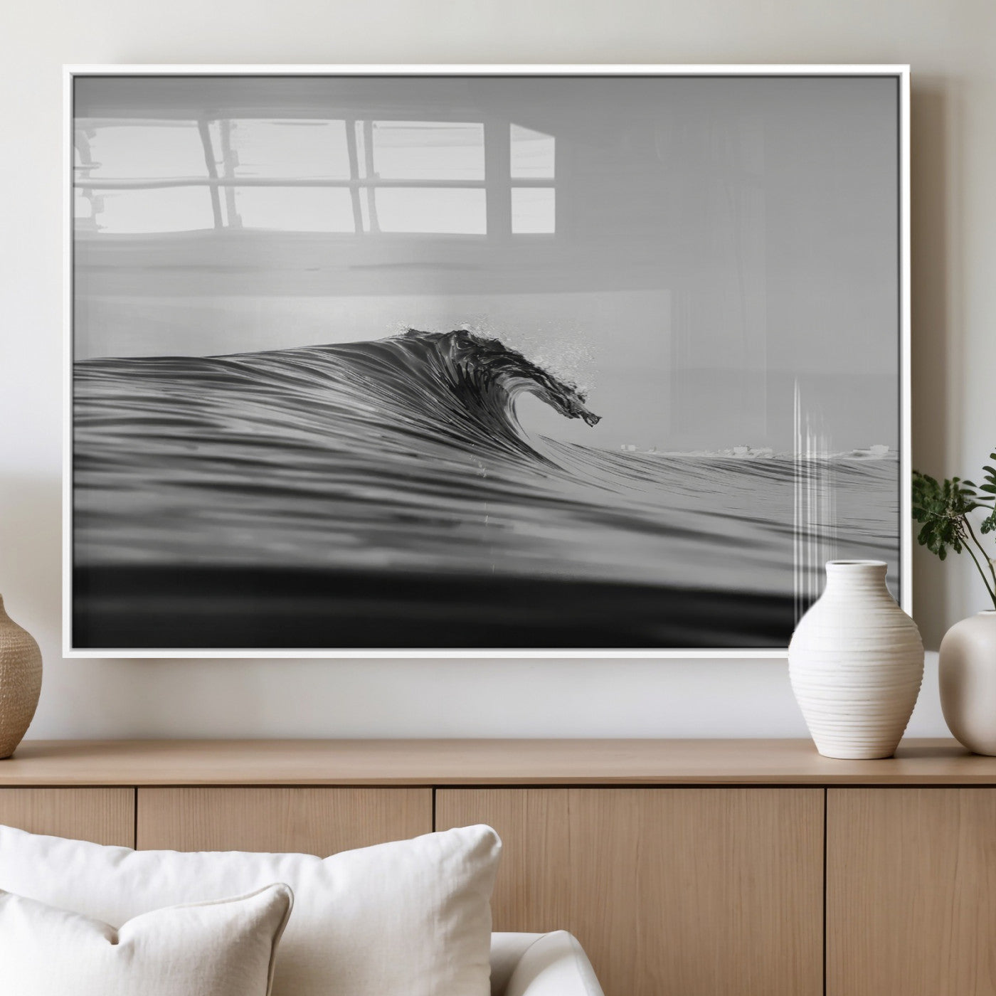 Striking black and white photo of a curling wave, ideal for modern coastal or minimalist wall decor settings.