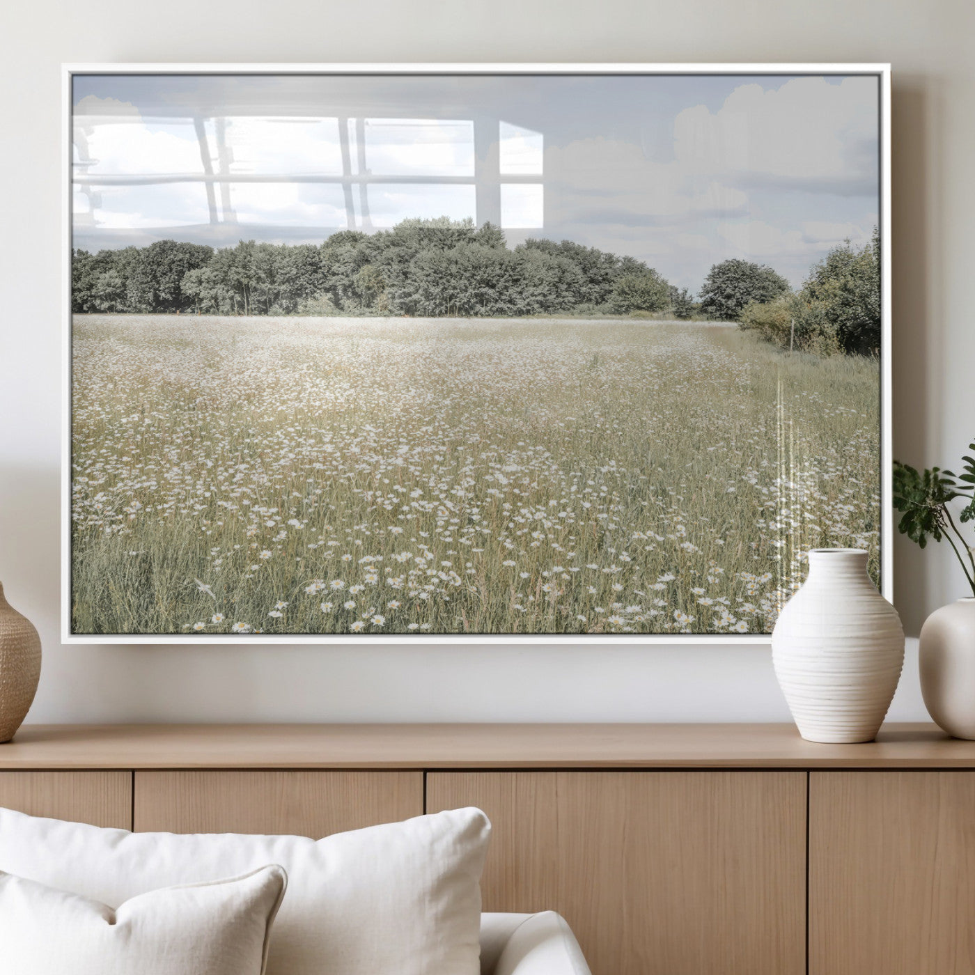 Soft-toned image of a wild daisy field under a cloudy sky, ideal for neutral or Scandinavian-inspired home decor.