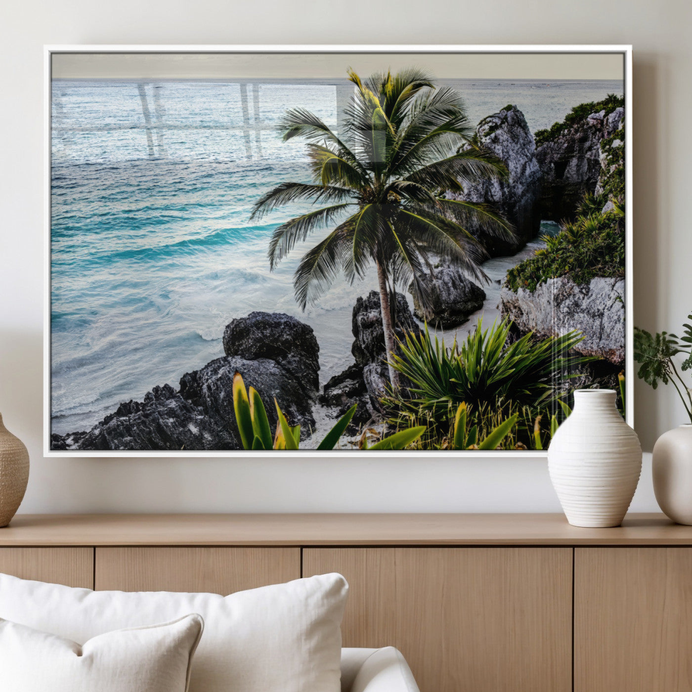 Framed canvas of a vibrant tropical coastline with palm trees, rocky cliffs, and turquoise waters, ideal for tropical coastal home decor.