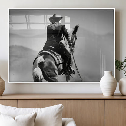 Black and white canvas of a cowboy on horseback with moody tones, perfect for rustic western or country-inspired home decor.