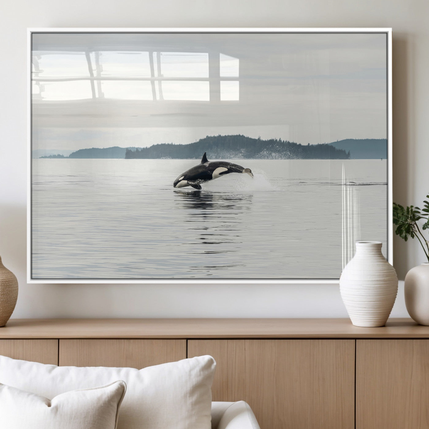 An orca jumping out of calm ocean waters with a misty island in the background, creating a serene and minimalist marine wildlife scene.
