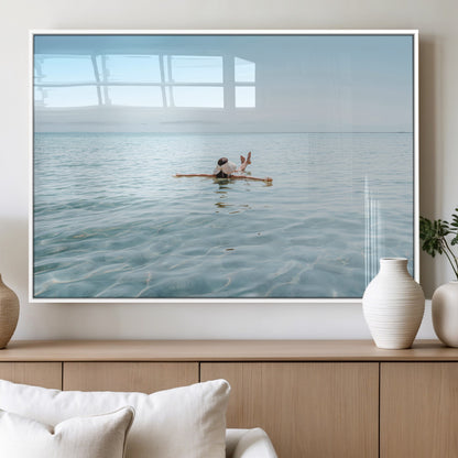 A peaceful minimalist scene of a person floating on crystal-clear water, surrounded by a vast open horizon, capturing relaxation and serenity in a tranquil aquatic setting.