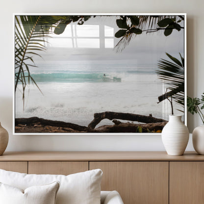 Tropical beach view with palm trees and surfer riding a wave, perfect for boho or coastal-inspired interior wall decor.