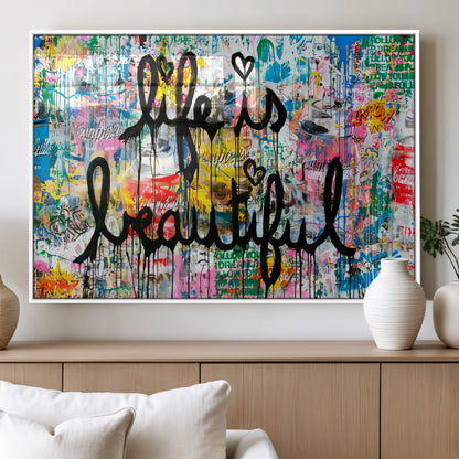 Colorful urban-style canvas with graffiti text “Life is Beautiful” in black paint, ideal for bold or street-themed home decor.