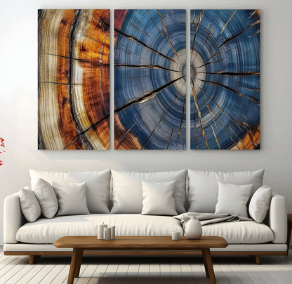 A stunning close-up view of a tree trunk, showcasing the intricate growth rings in a vibrant mix of warm browns, cool blues, and hints of natural texture.
