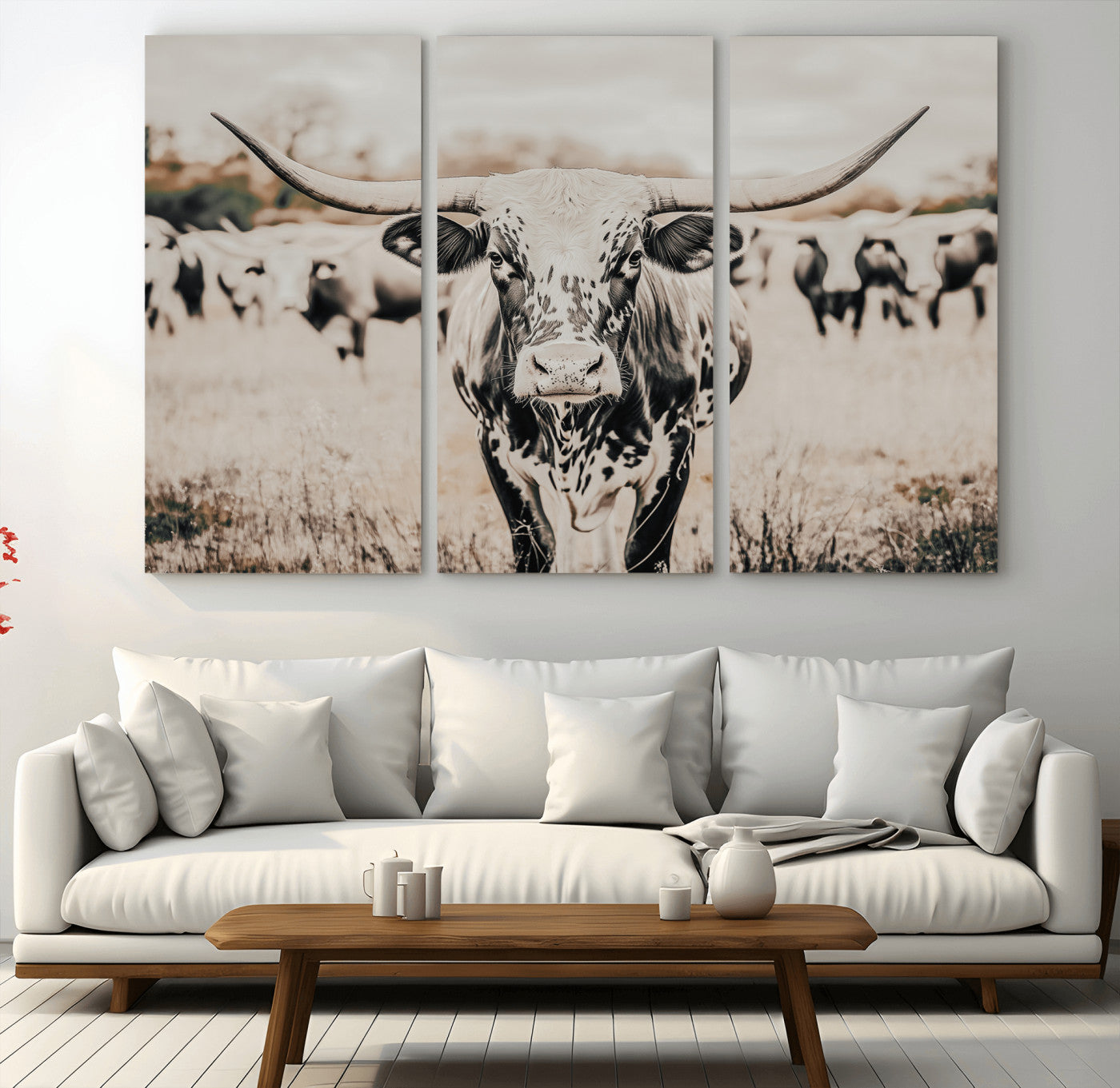 Canvas of a speckled Texas longhorn standing boldly in a field with a herd behind, perfect for rustic western or farmhouse wall decor.