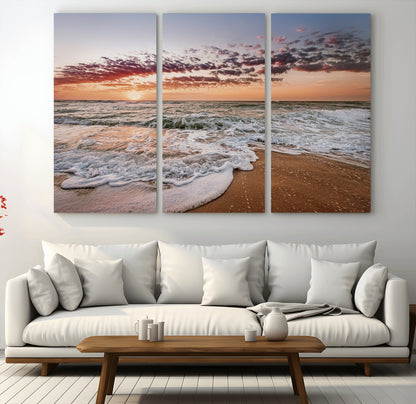 Canvas of a sunset over a foamy ocean shore with warm light and gentle waves, ideal for coastal or beach-themed home decor.