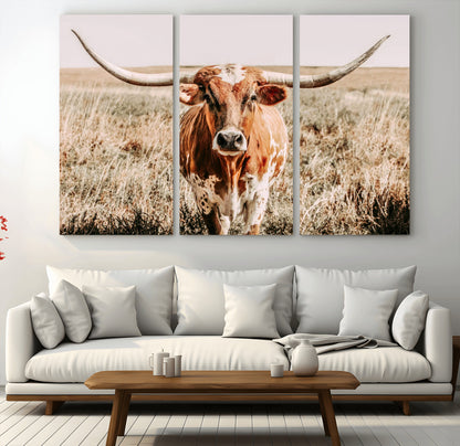 Framed longhorn cow canvas wall art with rustic prairie background, western animal print perfect for farmhouse or ranch style decor