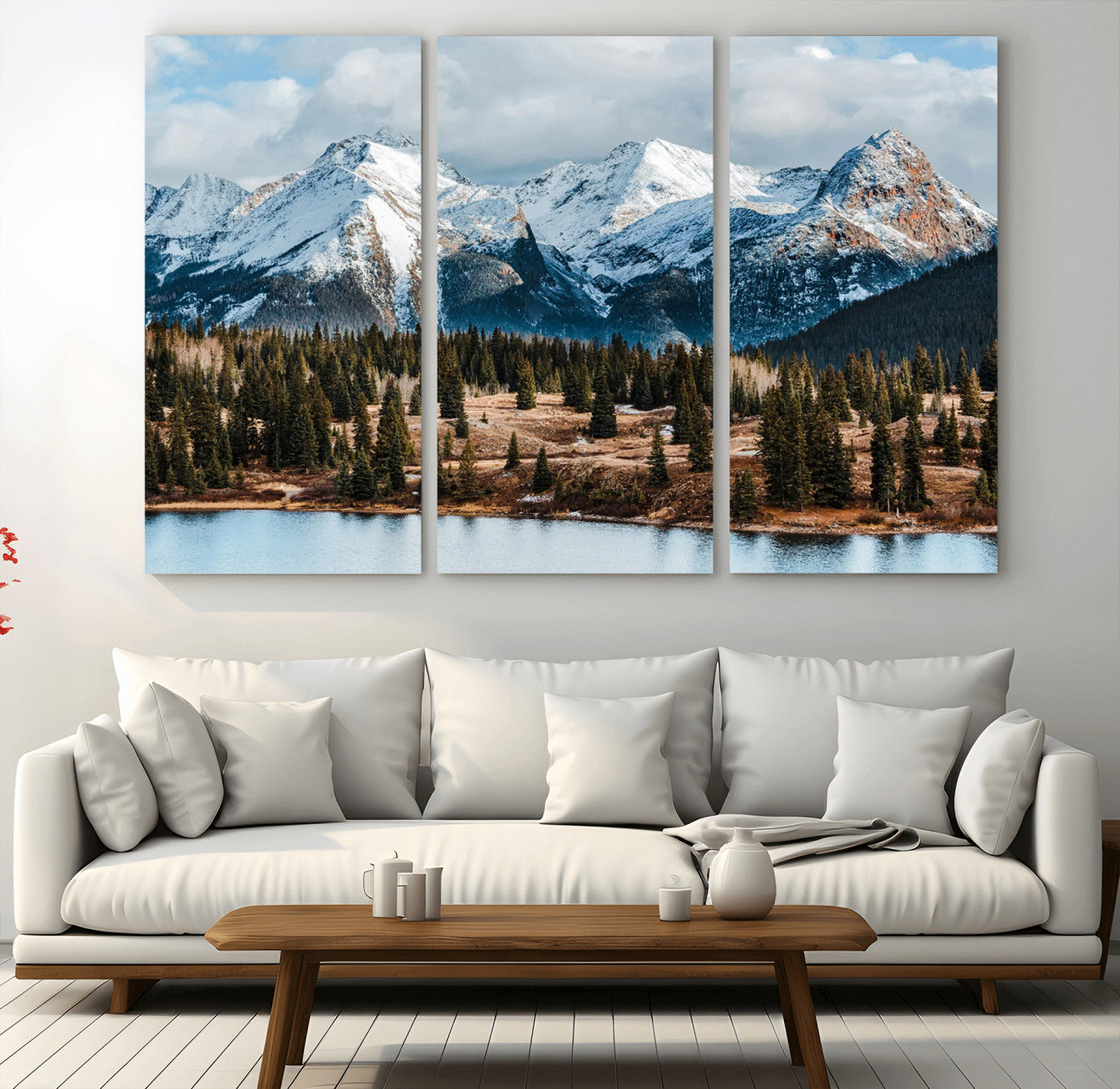 Framed canvas of snowy mountain peaks with pine forest and alpine lake, perfect for winter cabin or wilderness-inspired home decor.