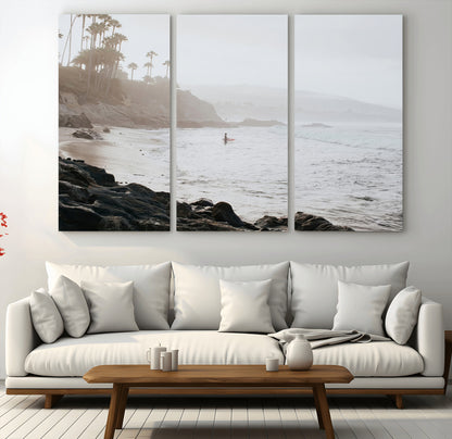 Framed canvas of a surfer in misty coastal tones at a foggy California beach, ideal for minimalist coastal beach or serene ocean-themed decor.