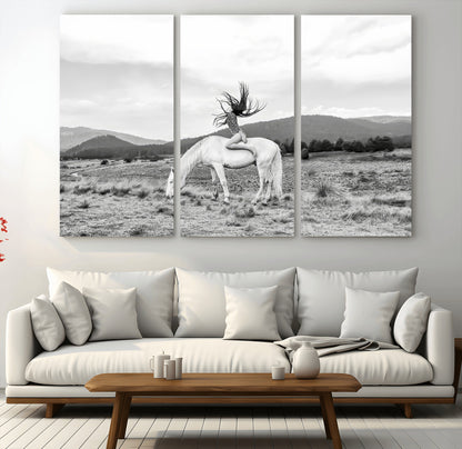 Black and white photo of a woman on a white horse in moody tones, ideal for Western Boho or modern rustic-style home decor.