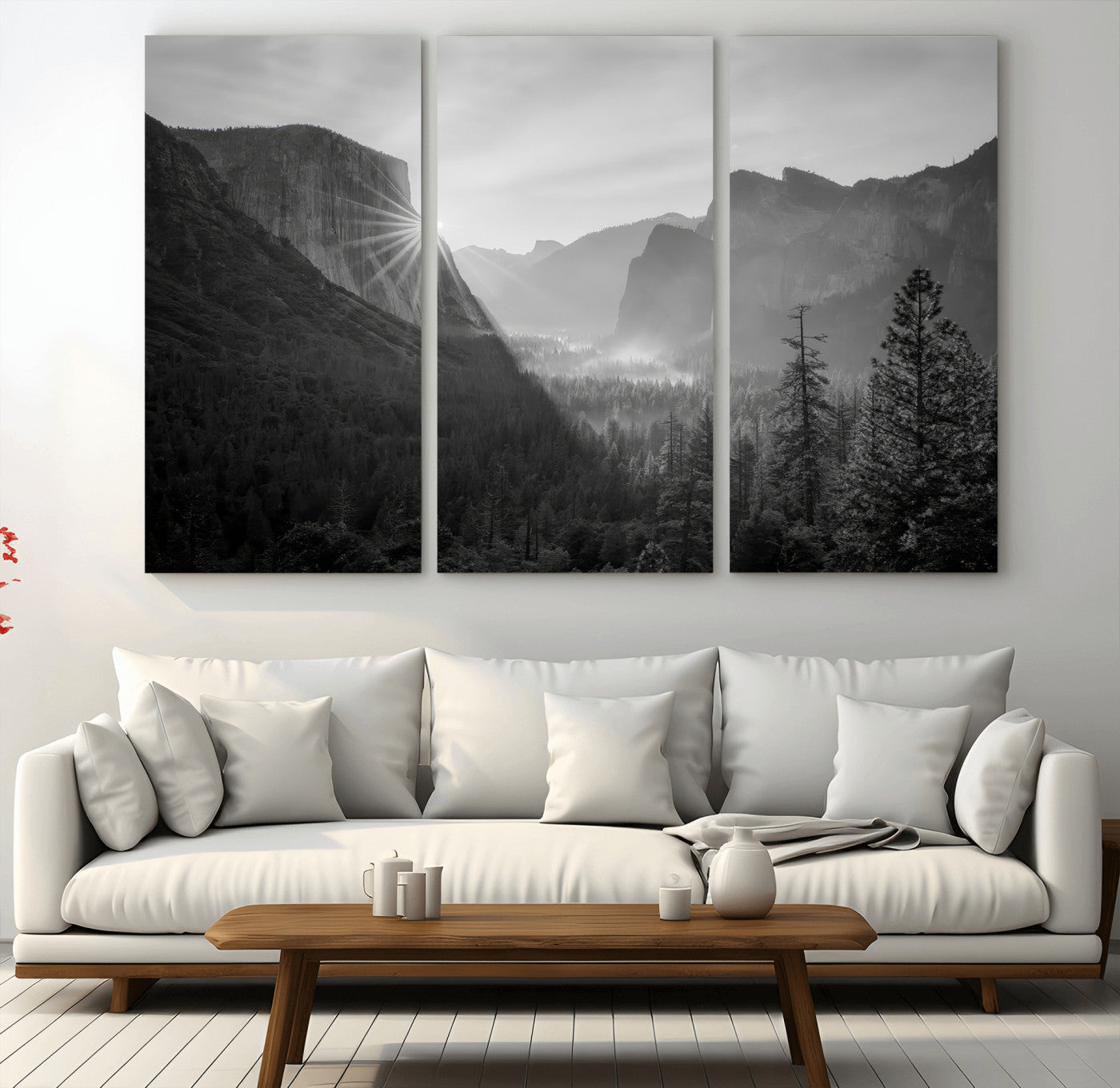 Black and white landscape of Yosemite with sun rays peeking over El Capitan, ideal for moody nature or modern rustic decor.