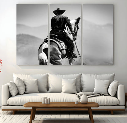 Black and white canvas of a cowboy on horseback with moody tones, perfect for rustic western or country-inspired home decor.