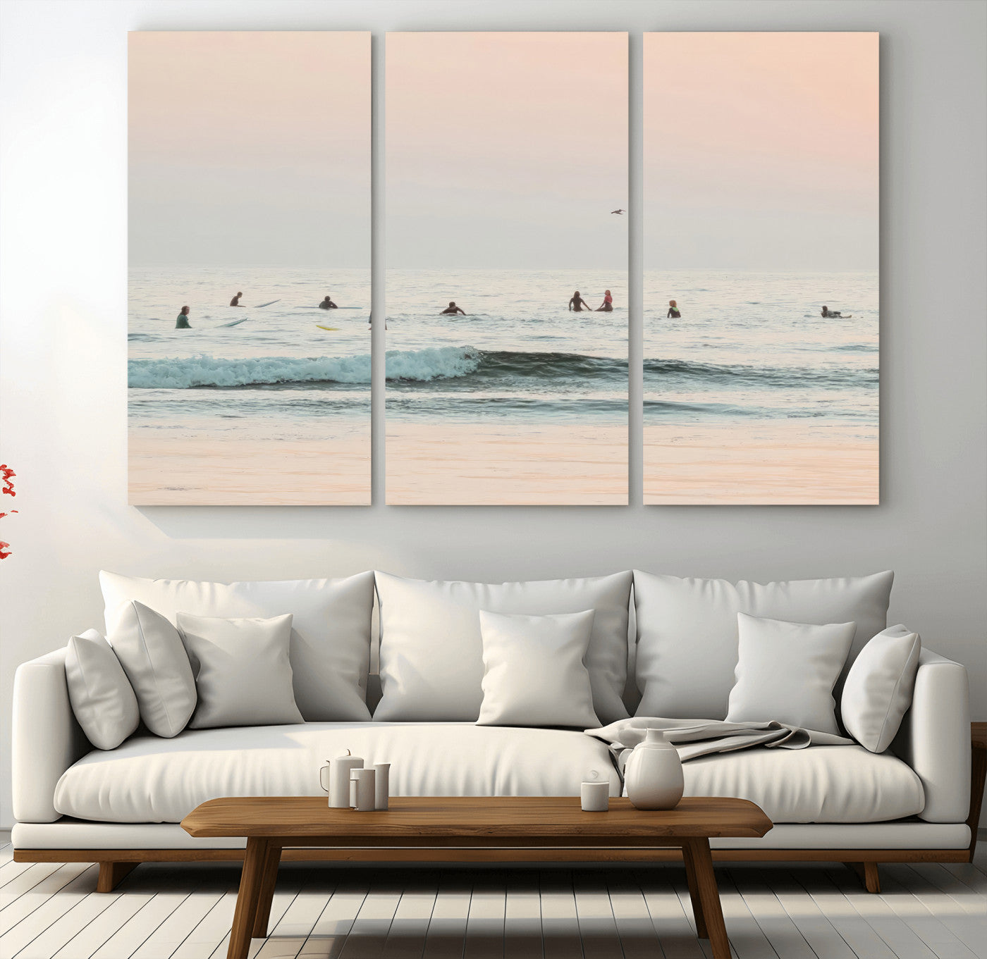 Dreamy photo of surfers waiting on soft pastel waves under a pink sunset sky, ideal for soft coastal minimalist or serene ocean-themed home decor.