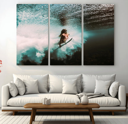 Vibrant underwater photo of a female surfer diving through turquoise waves, perfect for coastal boho or surf-inspired home decor.