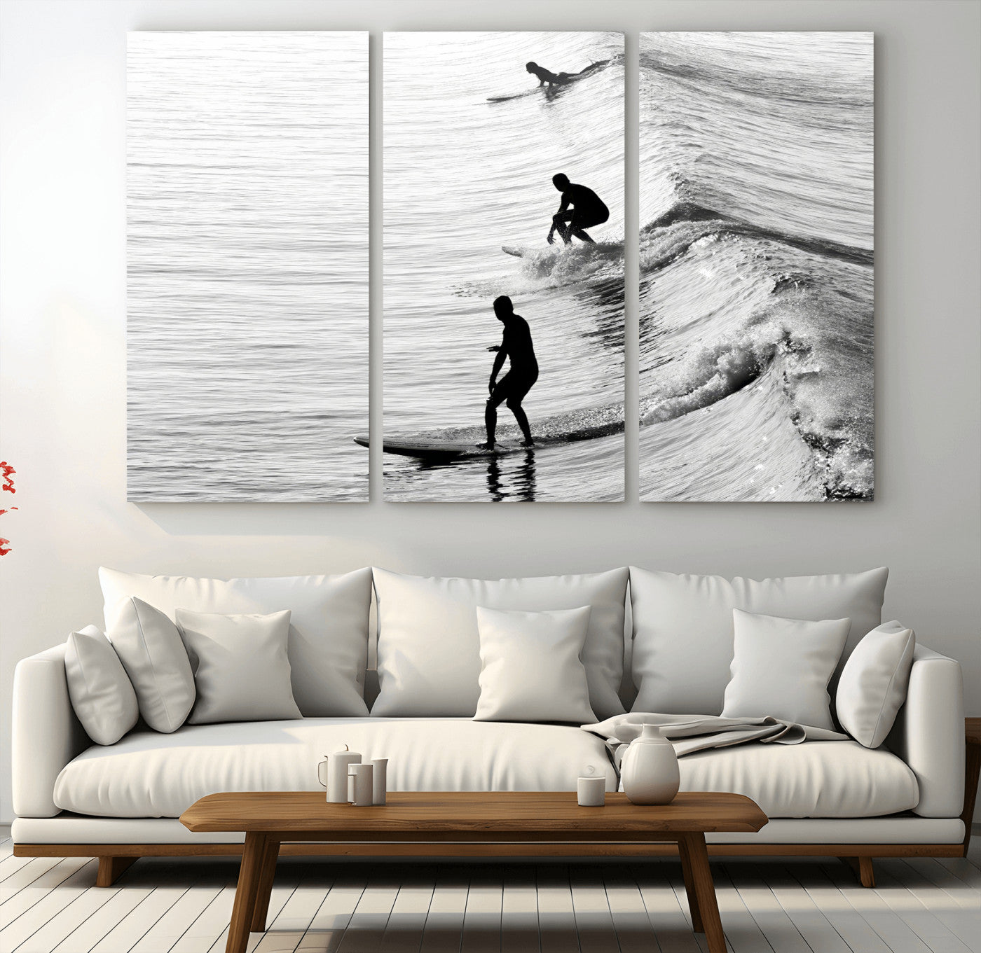 Black and white photo of surfers riding waves in a moody, high-contrast scene, ideal for modern coastal or surf-inspired home decor.