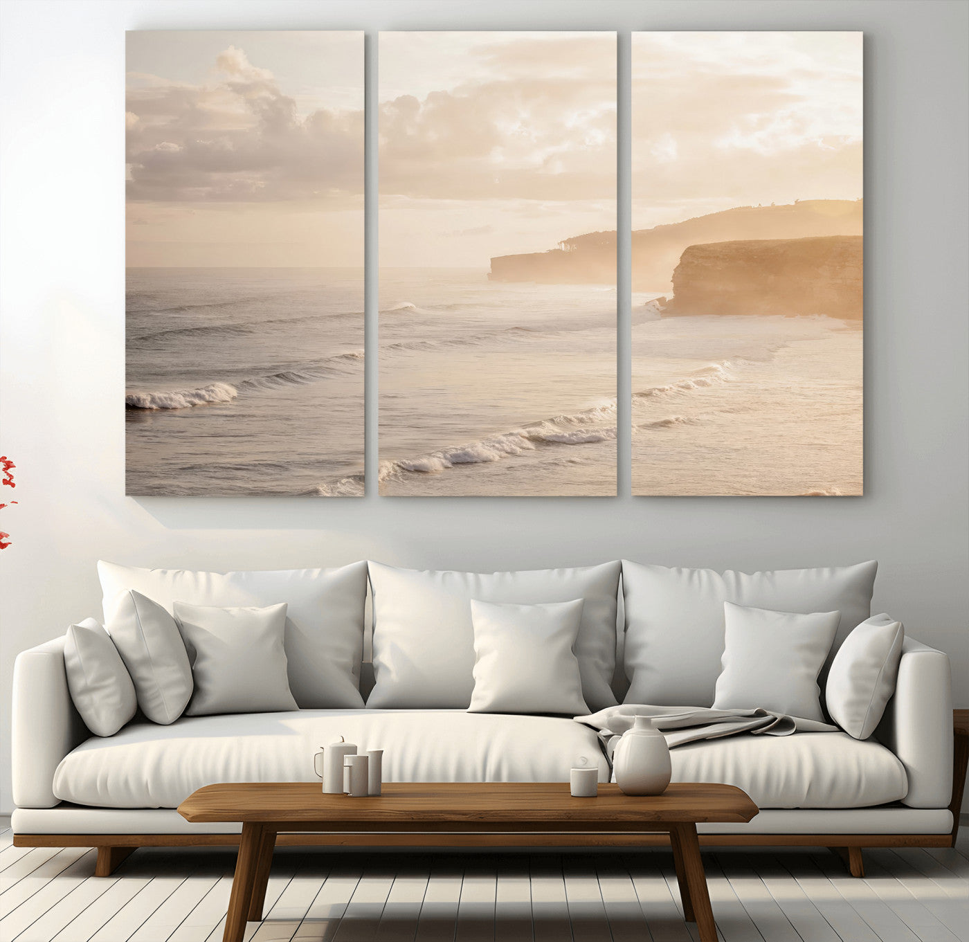 Golden hour seascape with misty cliffs and gentle waves rolling towards the shore, capturing a tranquil and warm coastal atmosphere.