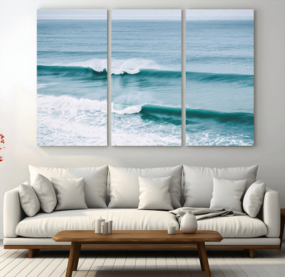 Powerful ocean waves rolling towards the shore, their turquoise hues blending with white sea foam under an open horizon, capturing the essence of the ocean's movement.