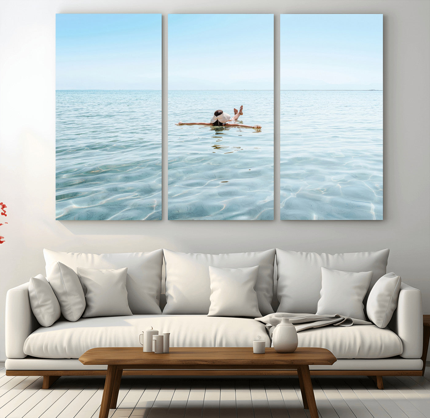 A peaceful minimalist scene of a person floating on crystal-clear water, surrounded by a vast open horizon, capturing relaxation and serenity in a tranquil aquatic setting.