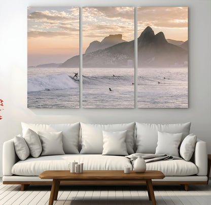 A surfer rides a golden hour wave near misty coastal mountains, surrounded by fellow surfers, capturing the spirit of a coastal adventure.